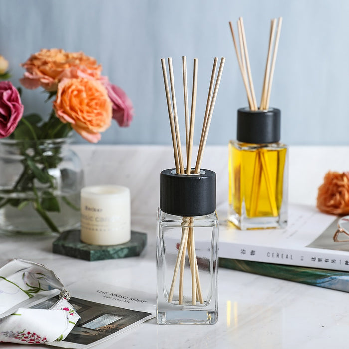 4.7” Tall Clear Square Glass Bottle Diffusers For Essential Oils with 24 pcs Black Reed Diffuser Sticks and  Black Wooden Caps, Set of 4 ( 3.4 oz ).